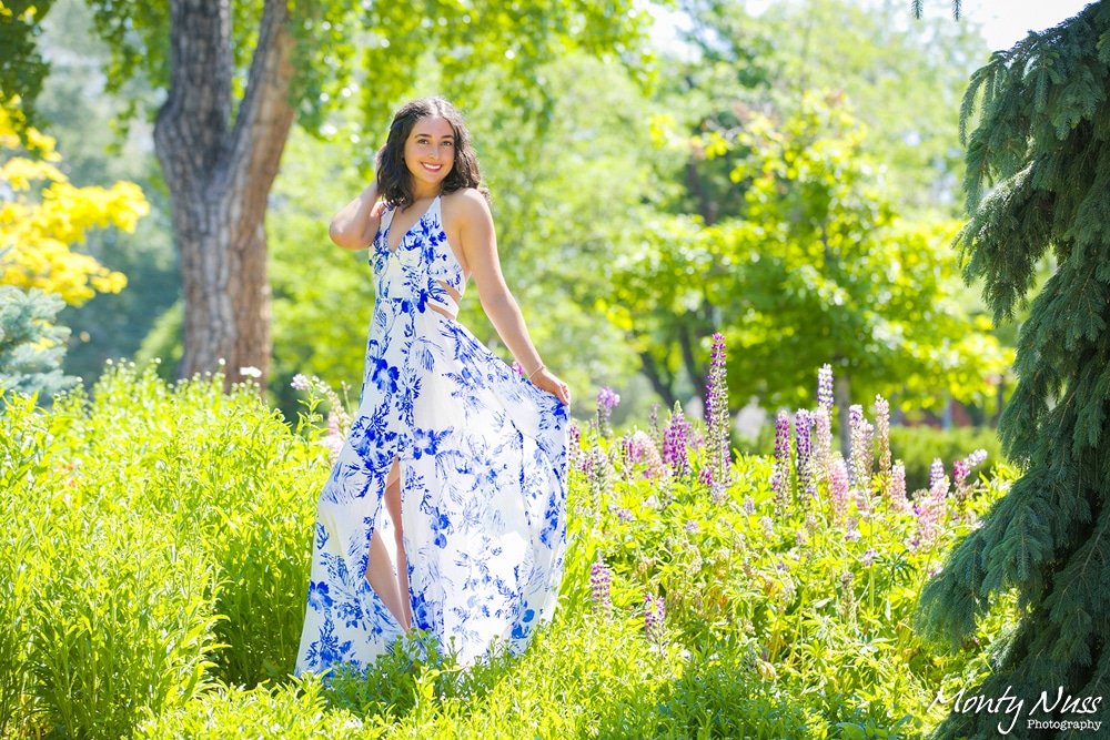 white blue pattern dress outside green trees flowers senior littleton photography
